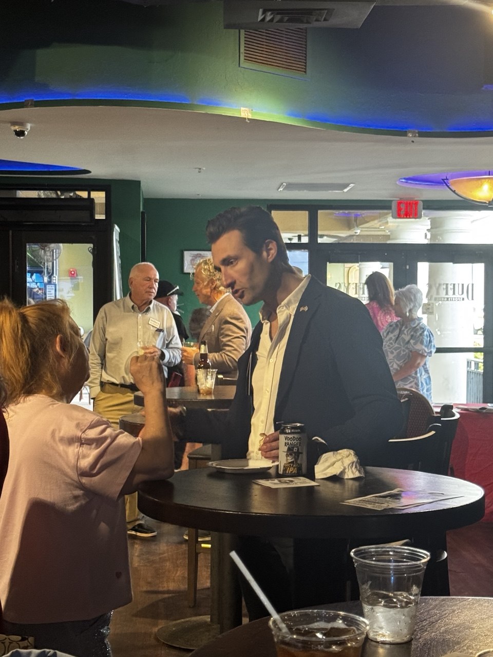 John Strand speaking with supporters